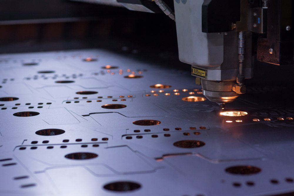 Laser Cutter Cutting Holes and Outlines Into Metal Sheet— Sheetmetal Improvements & Design in Burleigh Heads, QLD