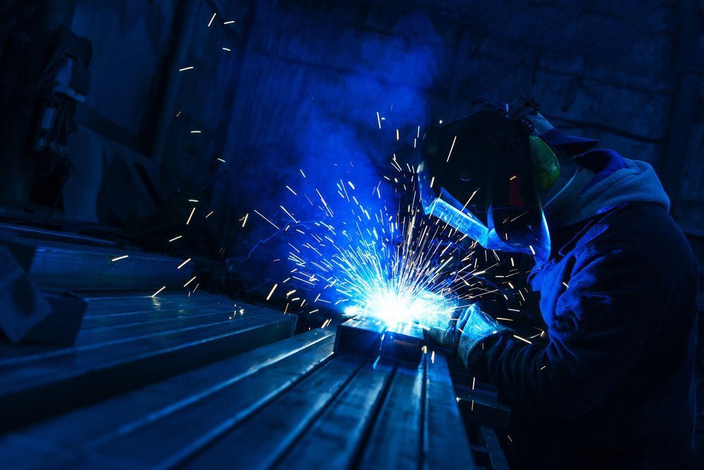 Welder in Protective Gear, Welding Metal — Sheetmetal Improvements & Design in Burleigh Heads, QLD