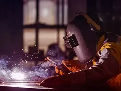 Welder in Protective Gear Welding Metal — Sheetmetal Improvements & Design in Burleigh Heads, QLD