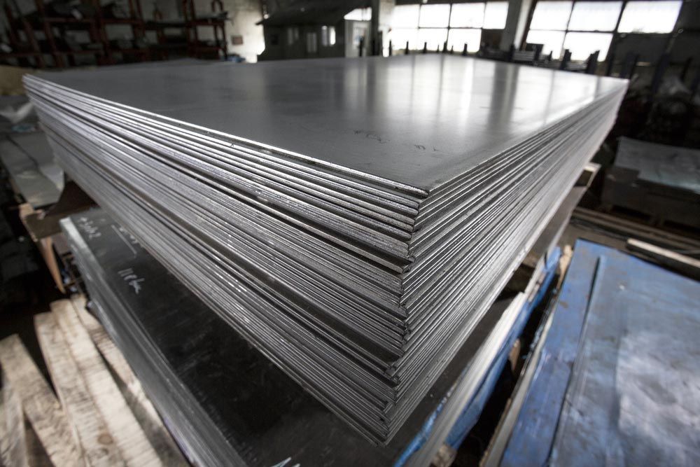 Stack of Rectangular Steel Sheets in a Factory Setting — Sheetmetal Improvements & Design in Burleigh Heads, QLD