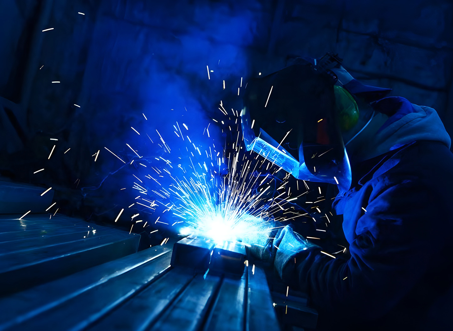 Welder Using Arc Welding On Metal With Sparks Flying — Sheetmetal Improvements & Design in Burleigh Heads, QLD