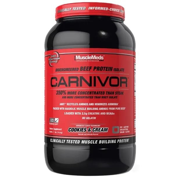 Contenedor grande rojo y negro de proteína de carne de res MuscleMeds Carnivor, sabor "Galletas y crema".