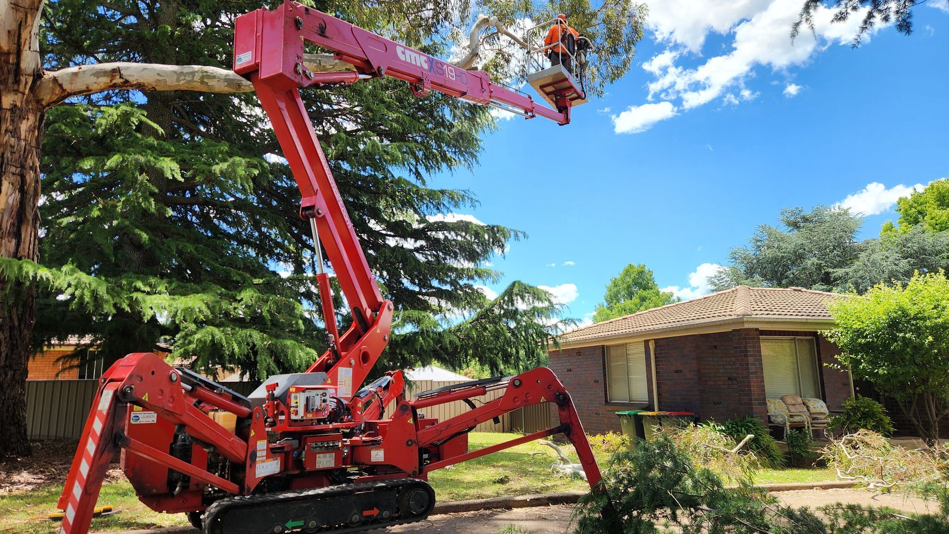 Pile of Cut Brush Blocking a Suburban Street Under a Blue Sky — Agile Arbor Pty Limited in Kelso, NSW
