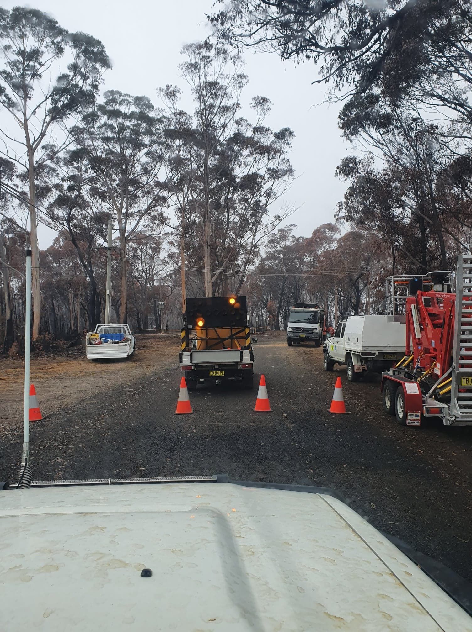 Vehicles on a Gravel Road, Possibly After a Fire — Agile Arbor Pty Limited in Blue Mountains, NSW