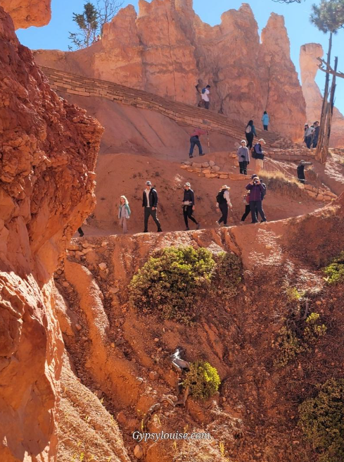 Hikers walking through Bryce Canyon’s Wall Street trail during government shutdown visit.