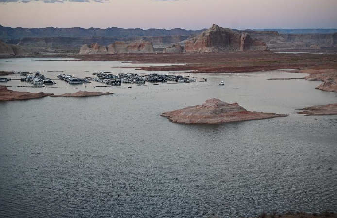 View of Glen Canyon Dam and Lake Powell under clear skies during the government shutdown.