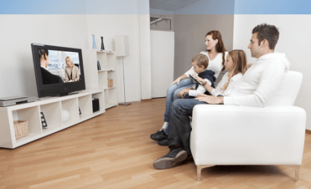 Family enjoying rental TV at home