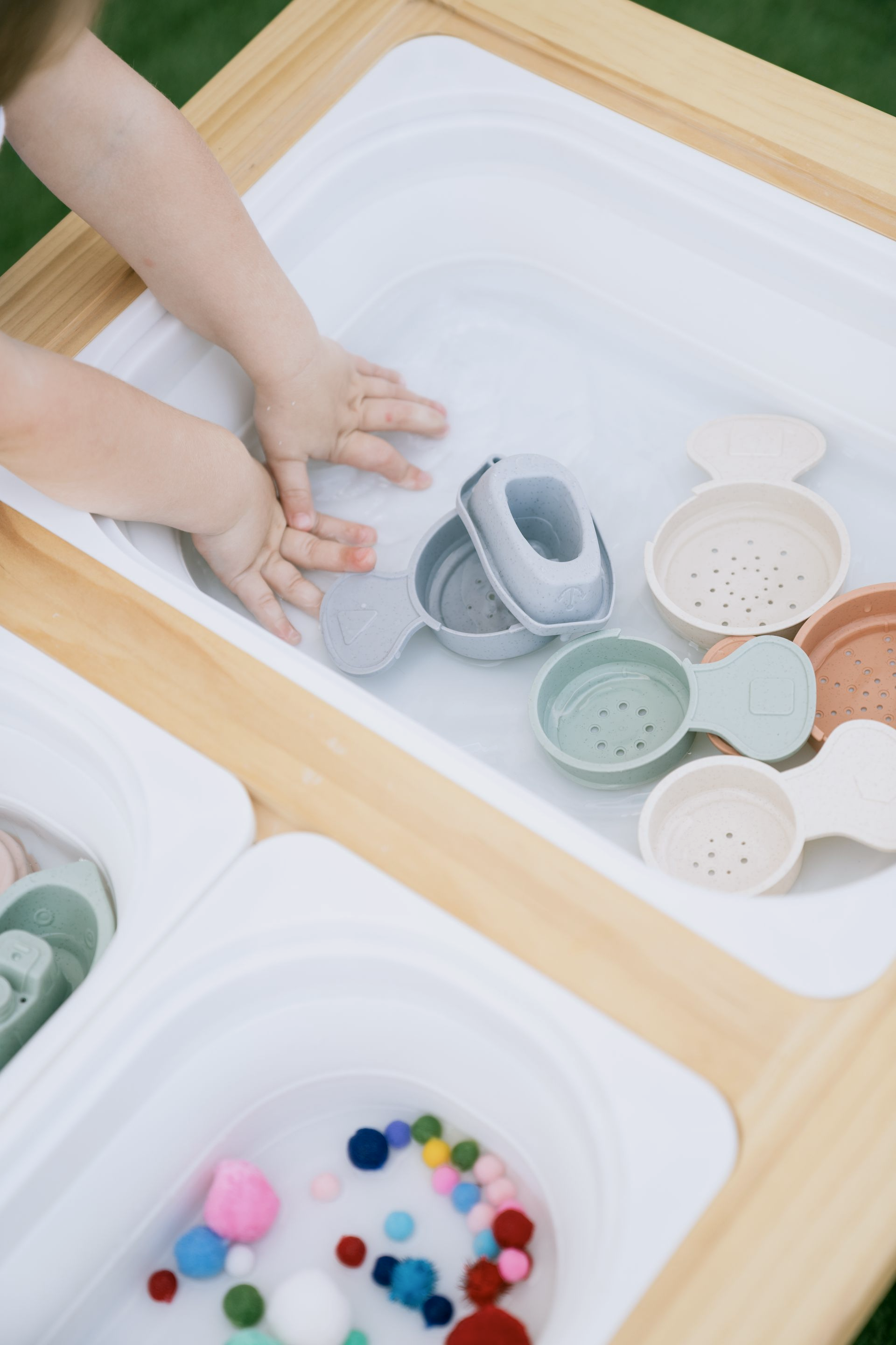 A little girl wearing a pumpkin patch shirt is being held by a woman.
