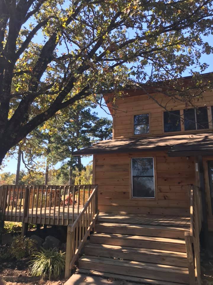 Nice wooden house next to tall trees — Morrilton, AR — Chadek Power Wash