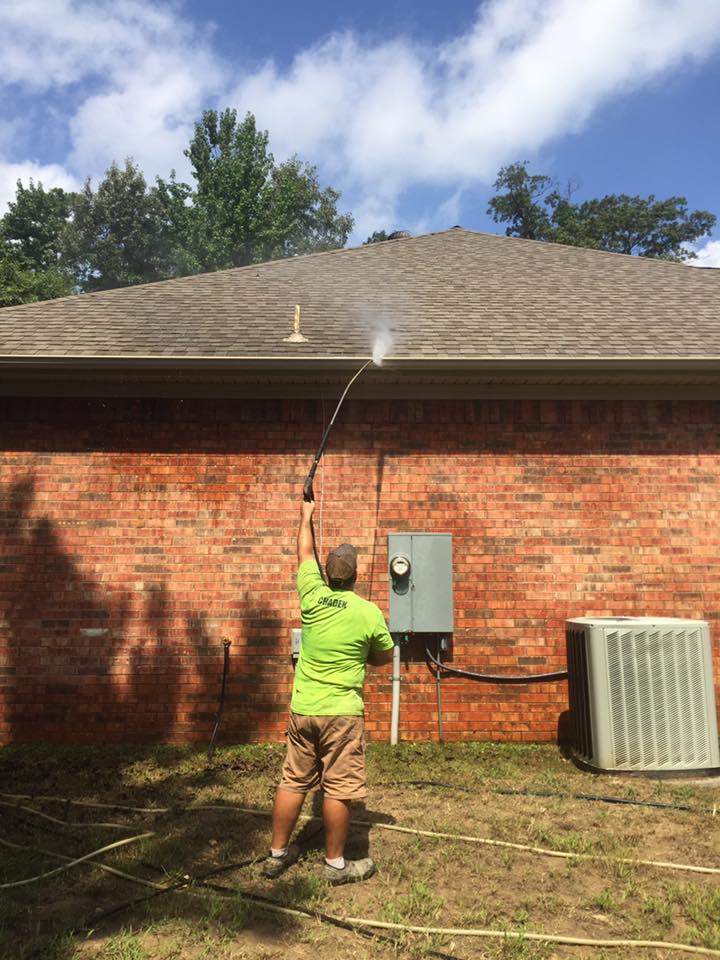 Man cleaning edges of roof — Morrilton, AR — Chadek Power Wash