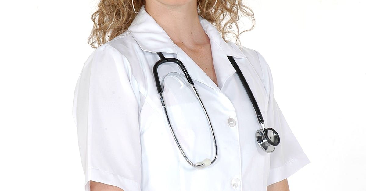 A female doctor wearing a white coat with a stethoscope around her neck.