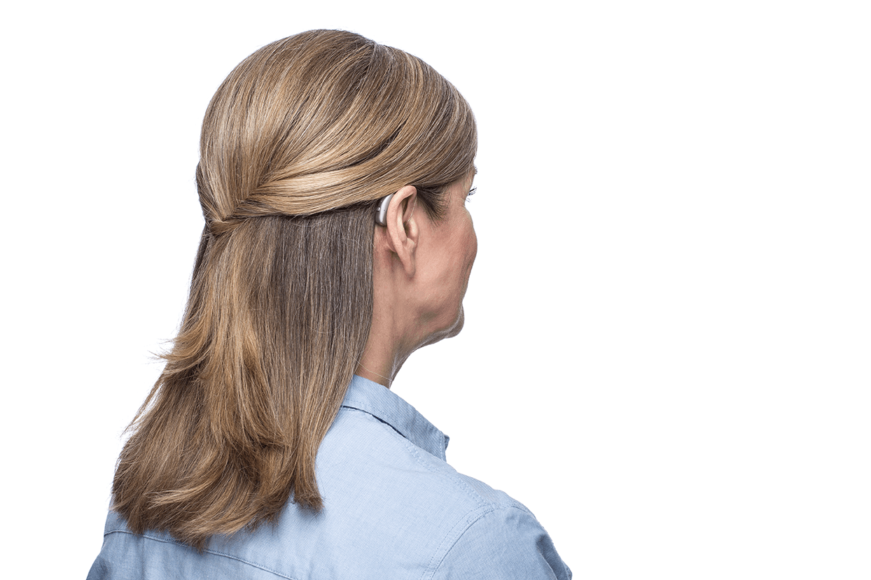 Receiver In Ear Hearing Aid On Woman