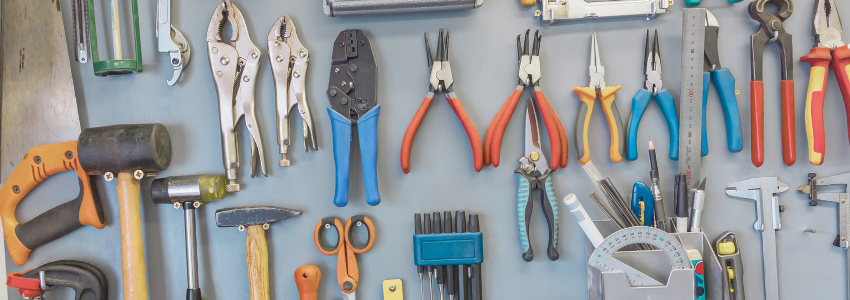 a lot of best tools hanging on the wall