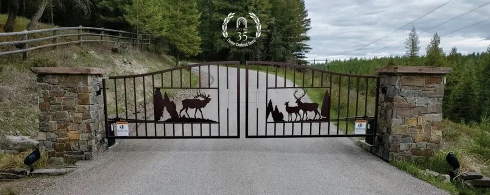A metal gate with a bear and a dog on it