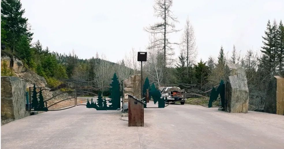 A road with trees on the side of it and a podium in the middle of it.