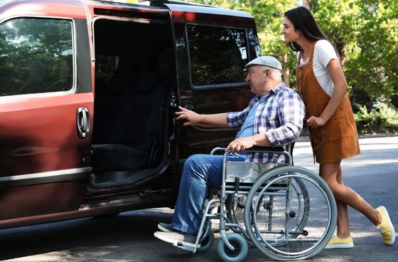 handicap boy on a wheelchair holding a basketball