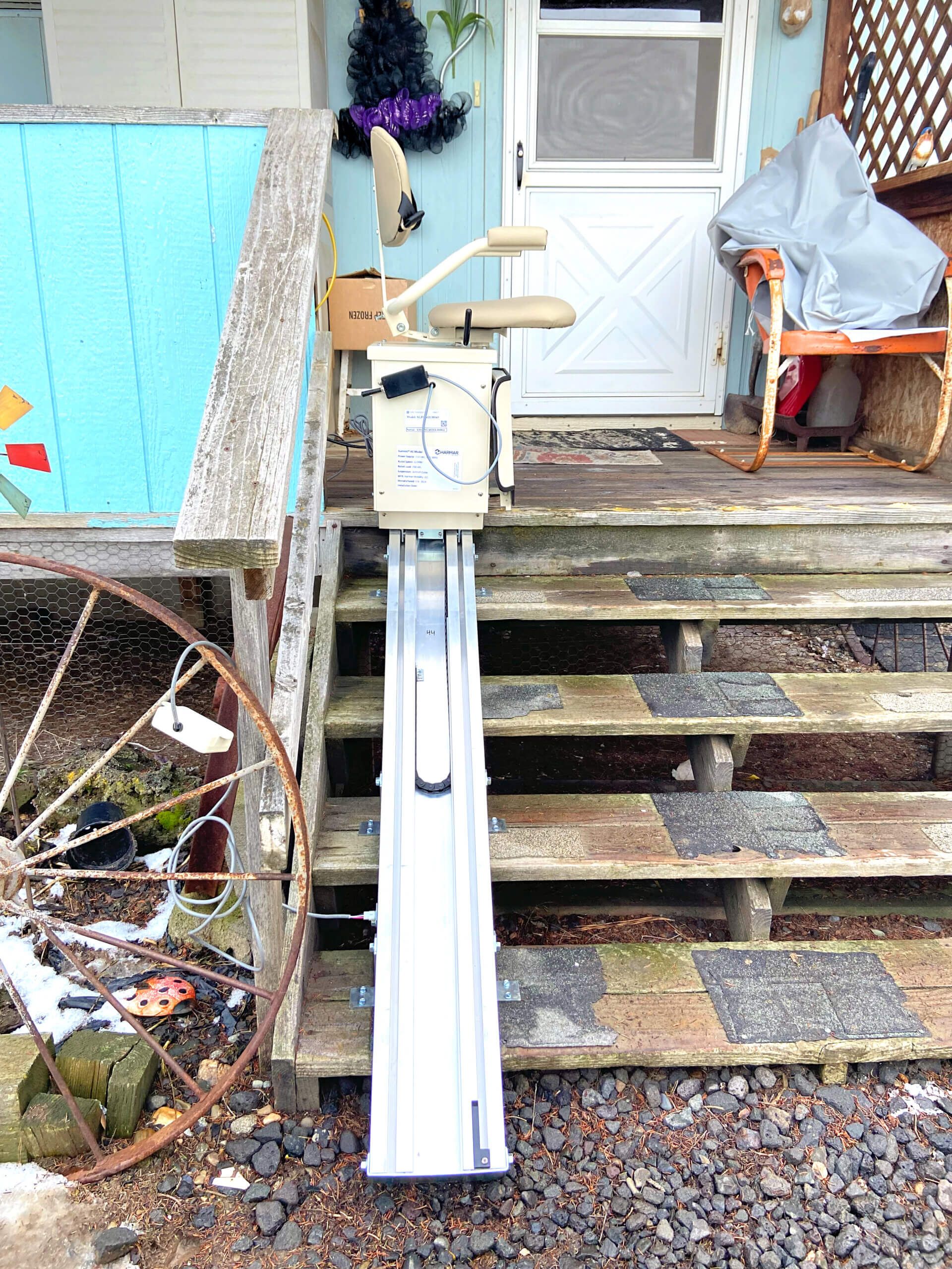 A wheelchair ramp is attached to a set of stairs