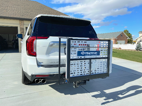 A white can with a Mobility Device Lift in the back. A white can with a Mobility Device Lift in the back.