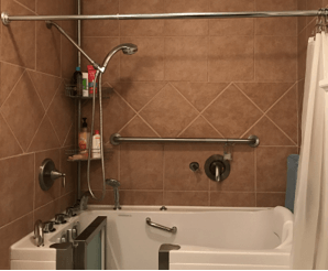 A bathroom with a walk in tub and a shower.