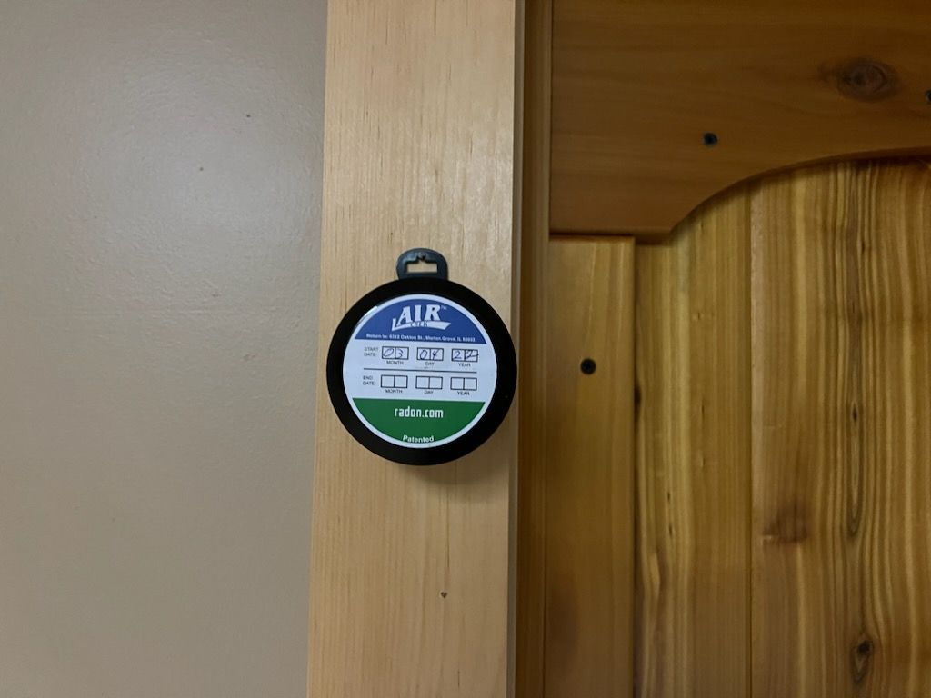 A Round Object is Hanging on a Wooden Door