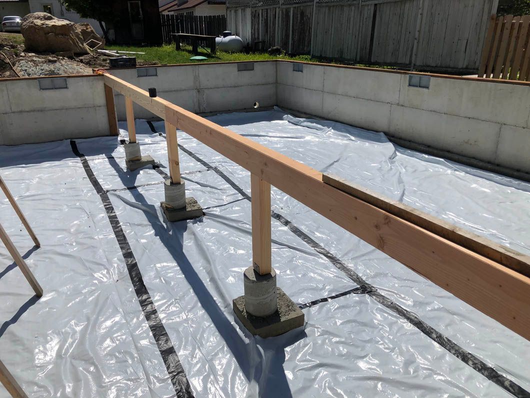 A Wooden Railing is Sitting on Top of a Plastic Tarp