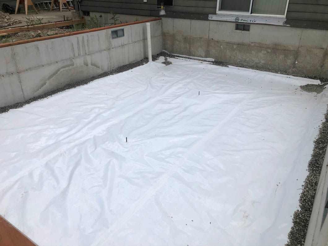 A Large White Tarp is Sitting on Top of a Concrete Floor