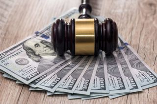 Child Custody — Judge's Gavel with Dollars  in Jacksonville, NC