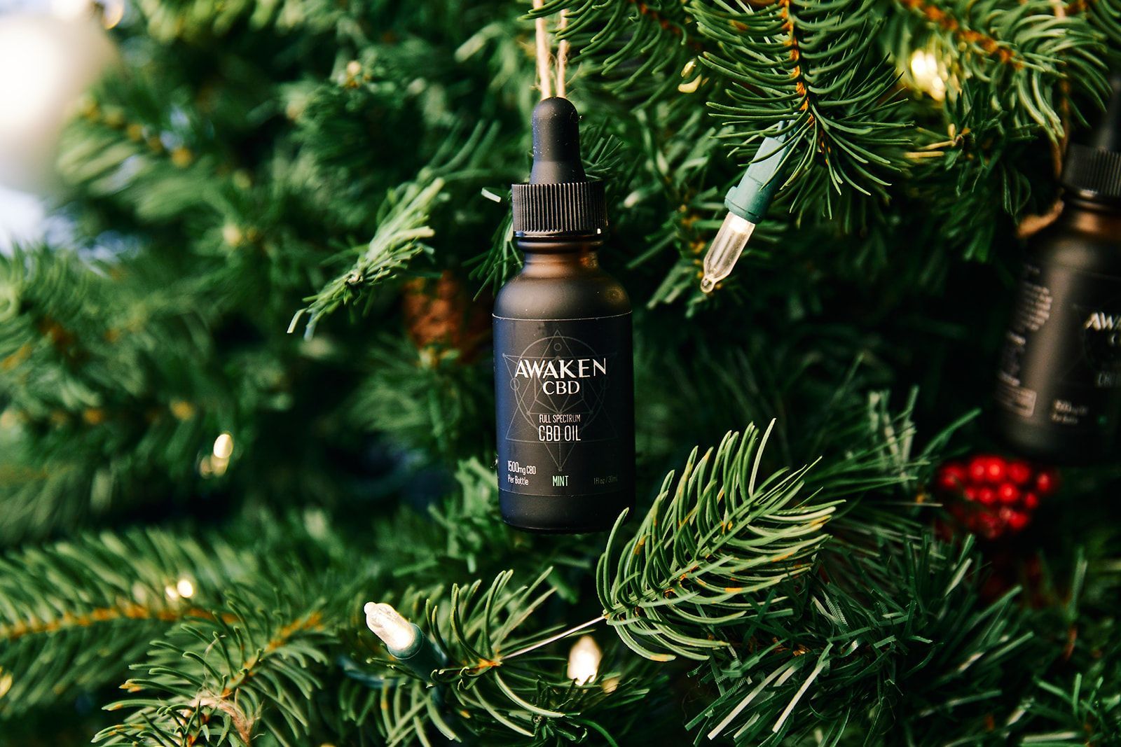 CBD oil hanging on Christmas Tree