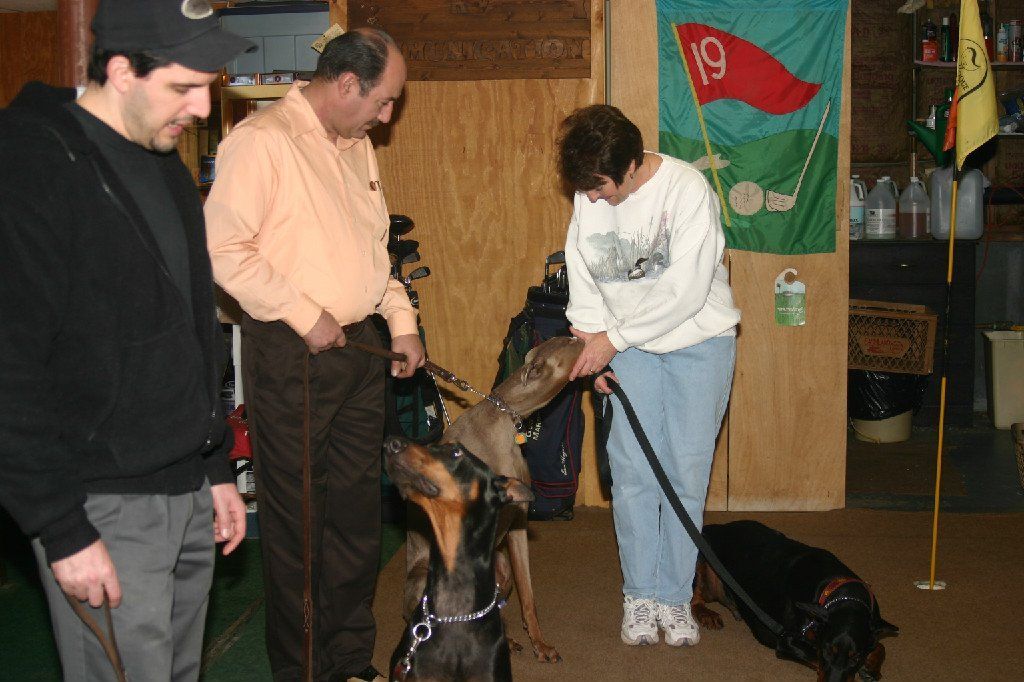 A group of people are standing in front of a flag with the number 19 on it