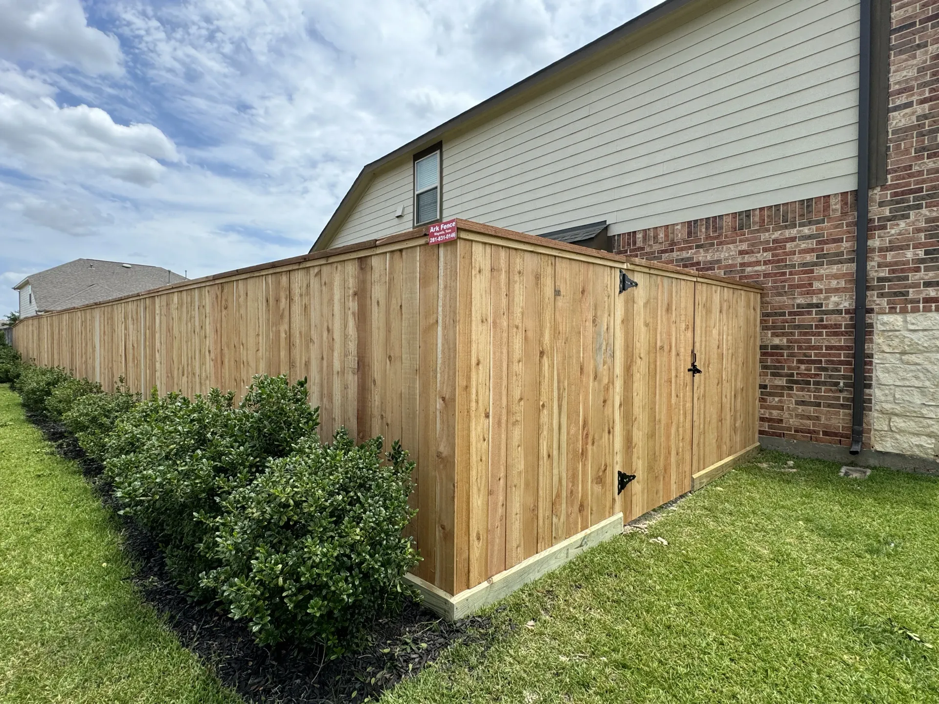 Backyard wood fence with gate by Ark Fence