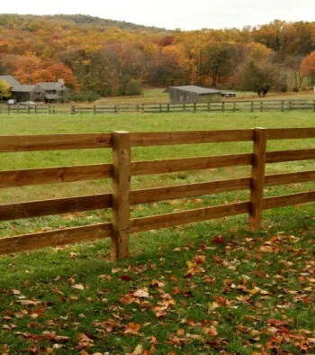 Freshly stained wood fence installed by Ark Fence