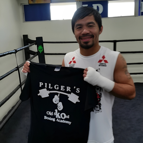 8 Division World Super Star Champion Manny Pacquiao holding a Pilgers Old Skool Boxing & FItness Academy t-shirt