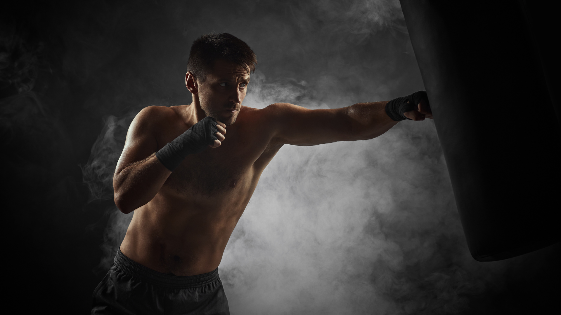 Mang training boxing using a punching bag