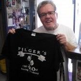 Hall of Fame Boxing Trainer Freddie Roach holding a Pilgers old Skool Boxing Fitness Academy t-shirt