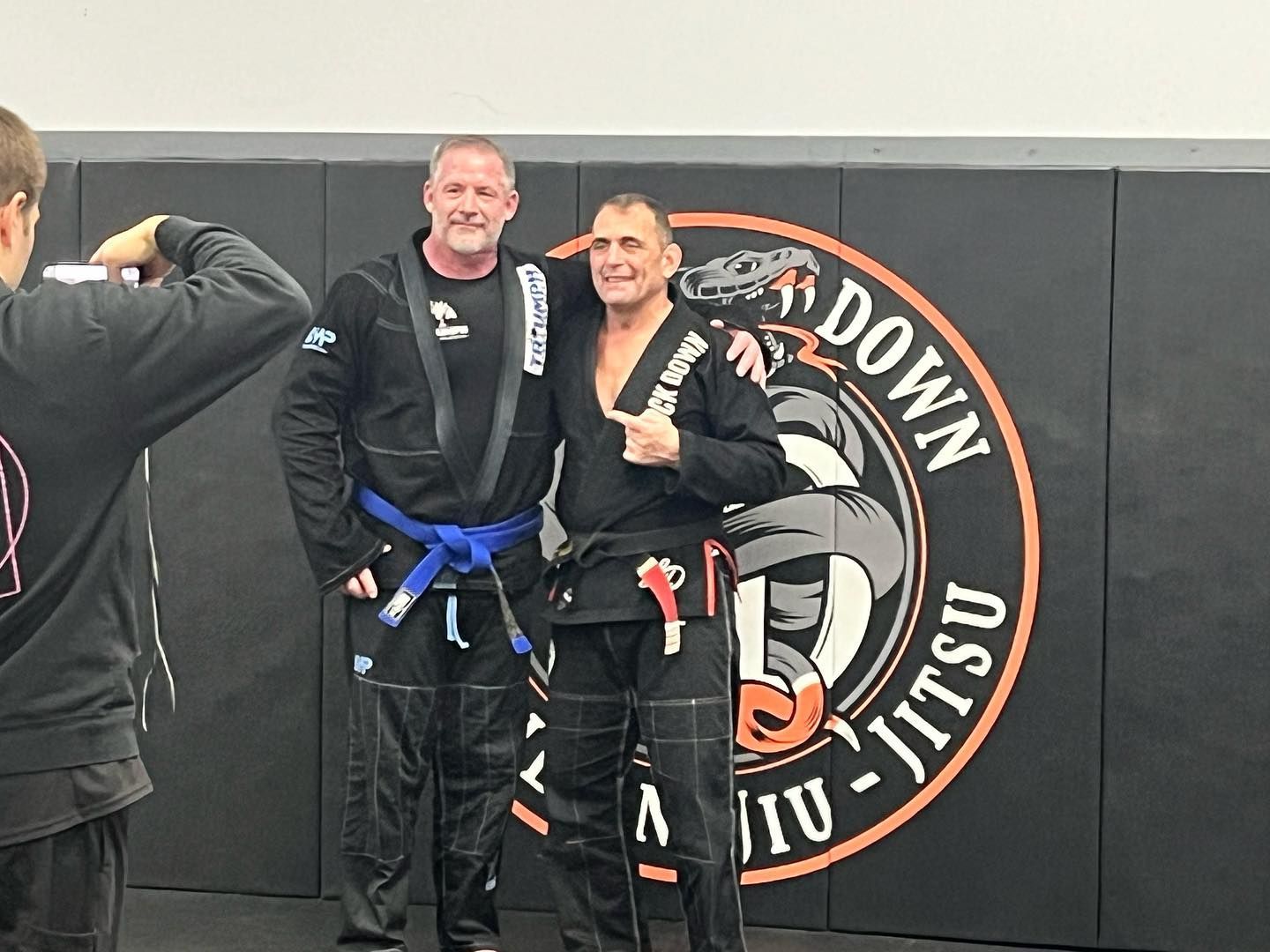 Adults drilling Brazilian Jiu Jitsu techniques at Lockdown BJJ in Lake Ronkonkoma, NY for fitness.