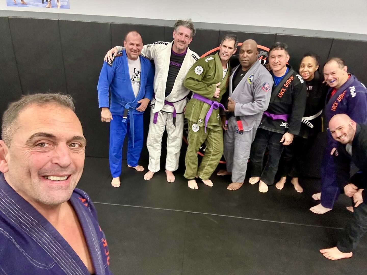Adults drilling Brazilian Jiu-Jitsu techniques at Lockdown BJJ in Lake Ronkonkoma, NY for confidence