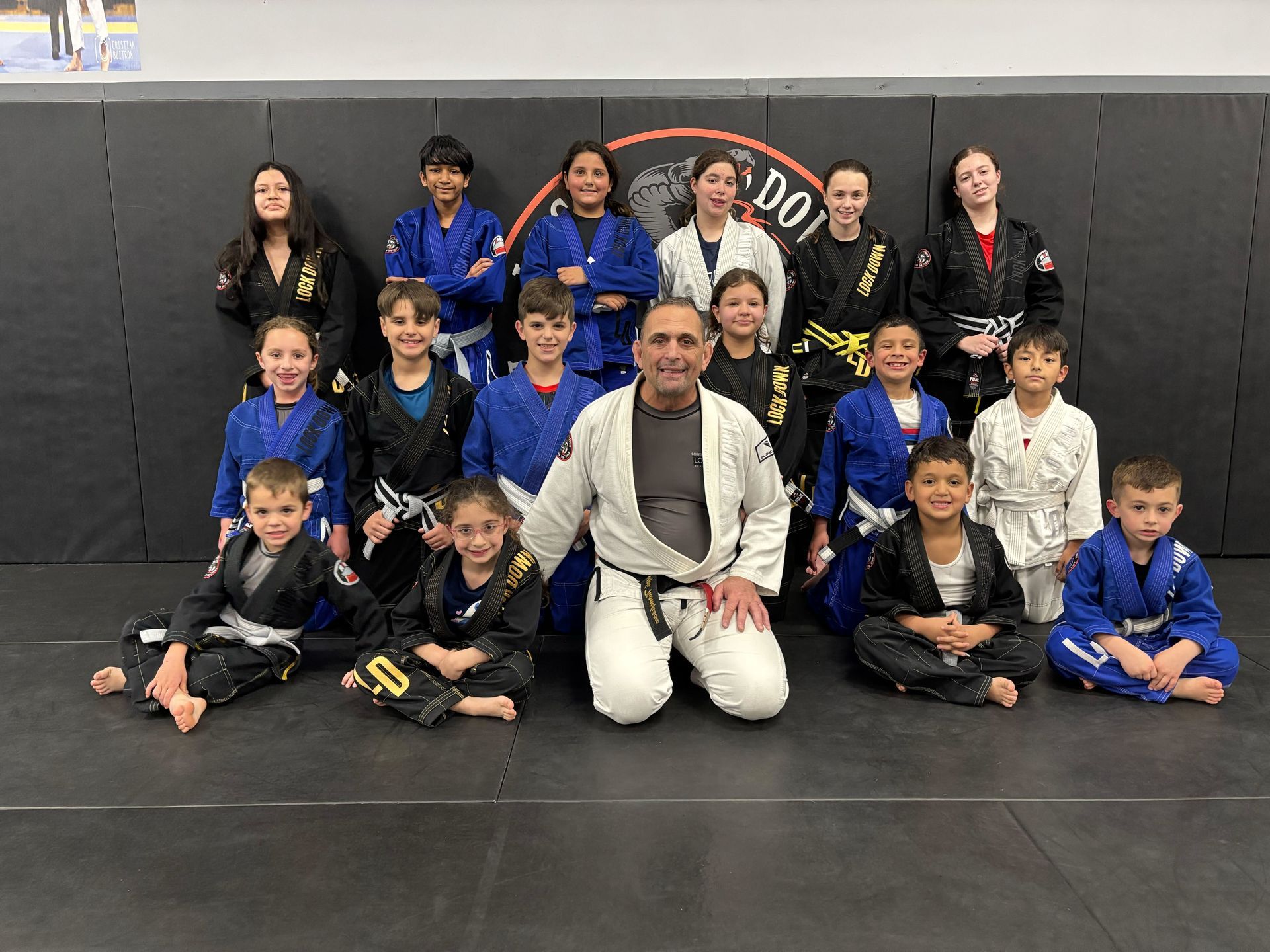 Students train brazilian jiu jitsu at Lockdown BJJ in Lake Ronkonkoma, NY, building fitness.