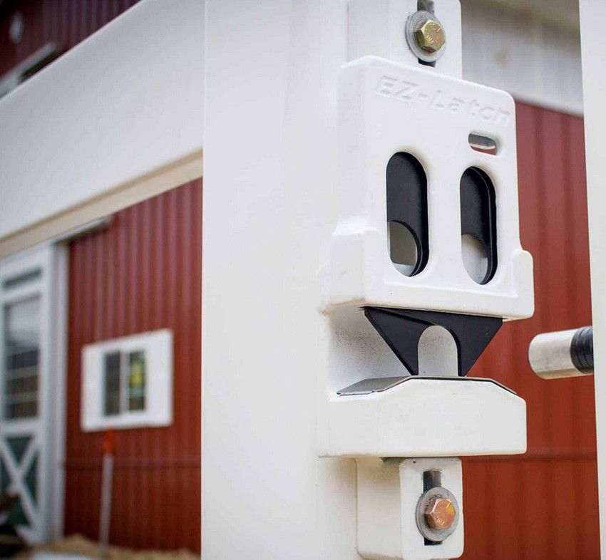 A white ez-lock is attached to a white pole