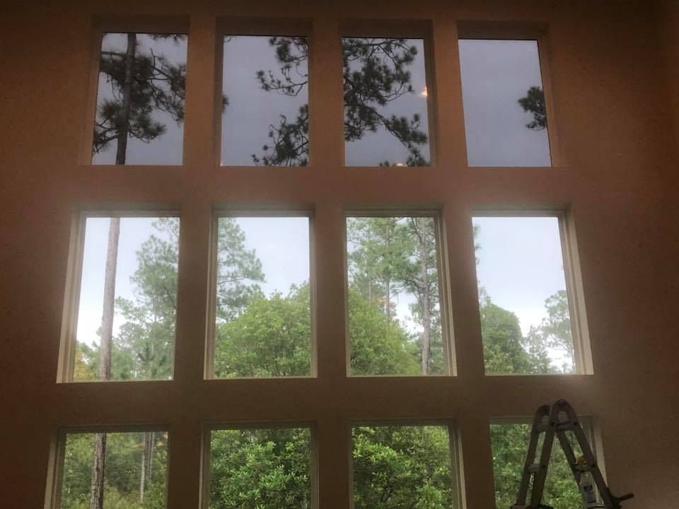 A large window with a ladder in front of it