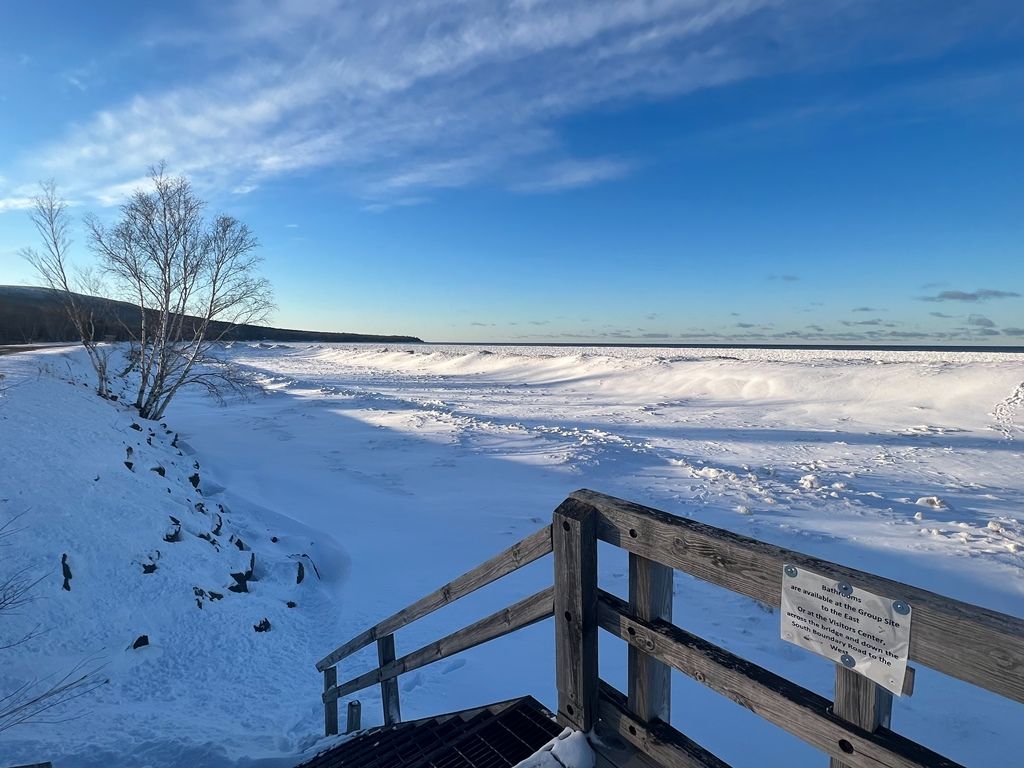 A snowy land with stairs leading up to it