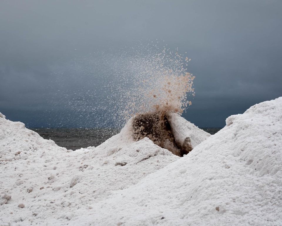 A large pile of snow is sitting on top of a hill