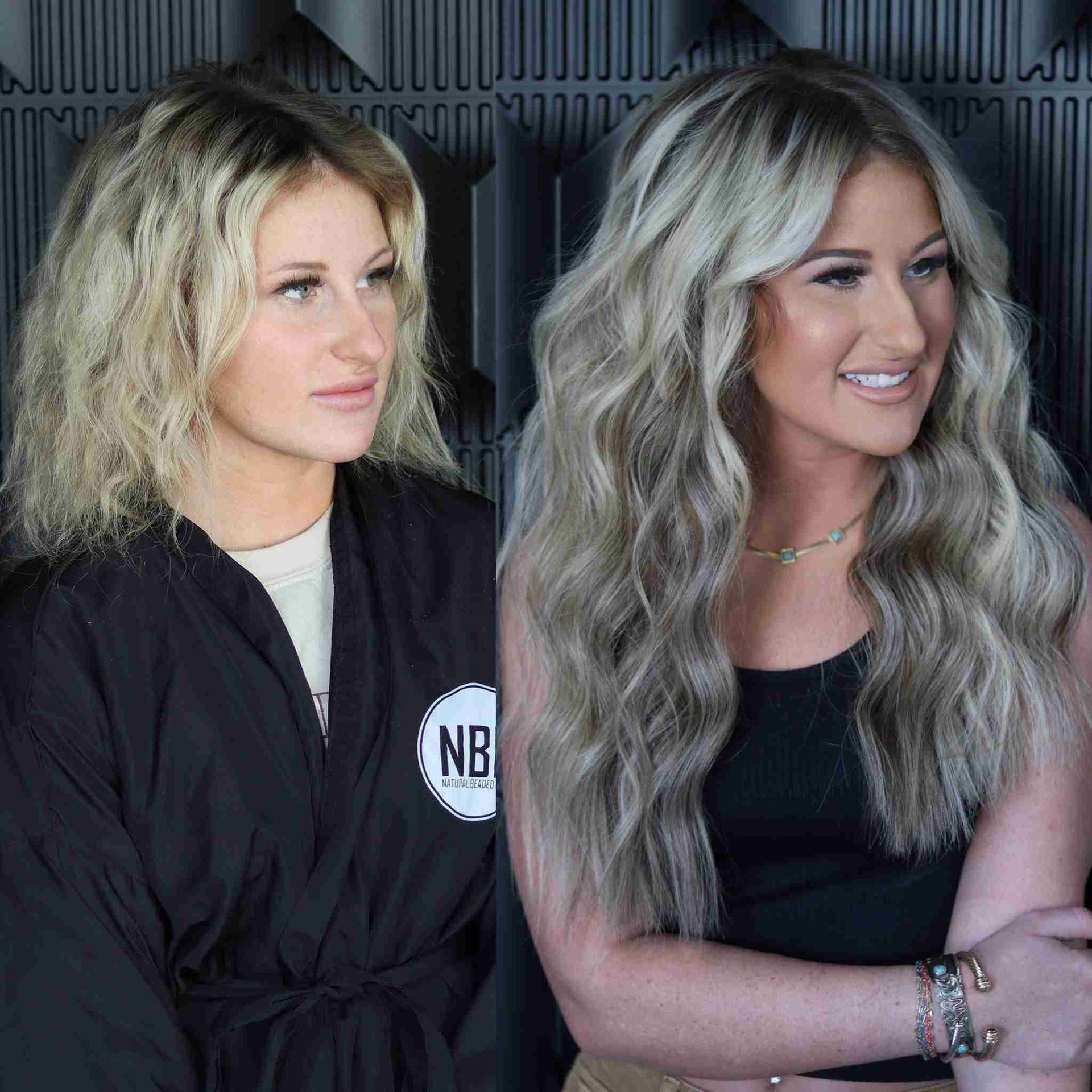 Two women are standing next to each other with one wearing a black robe that says nb