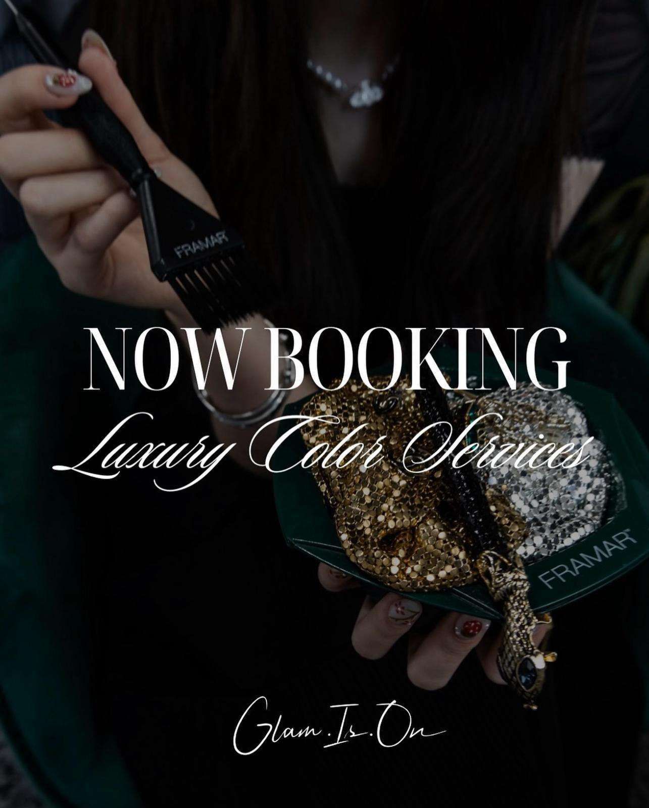 A woman is holding a brush with the words now booking luxury color services on it.