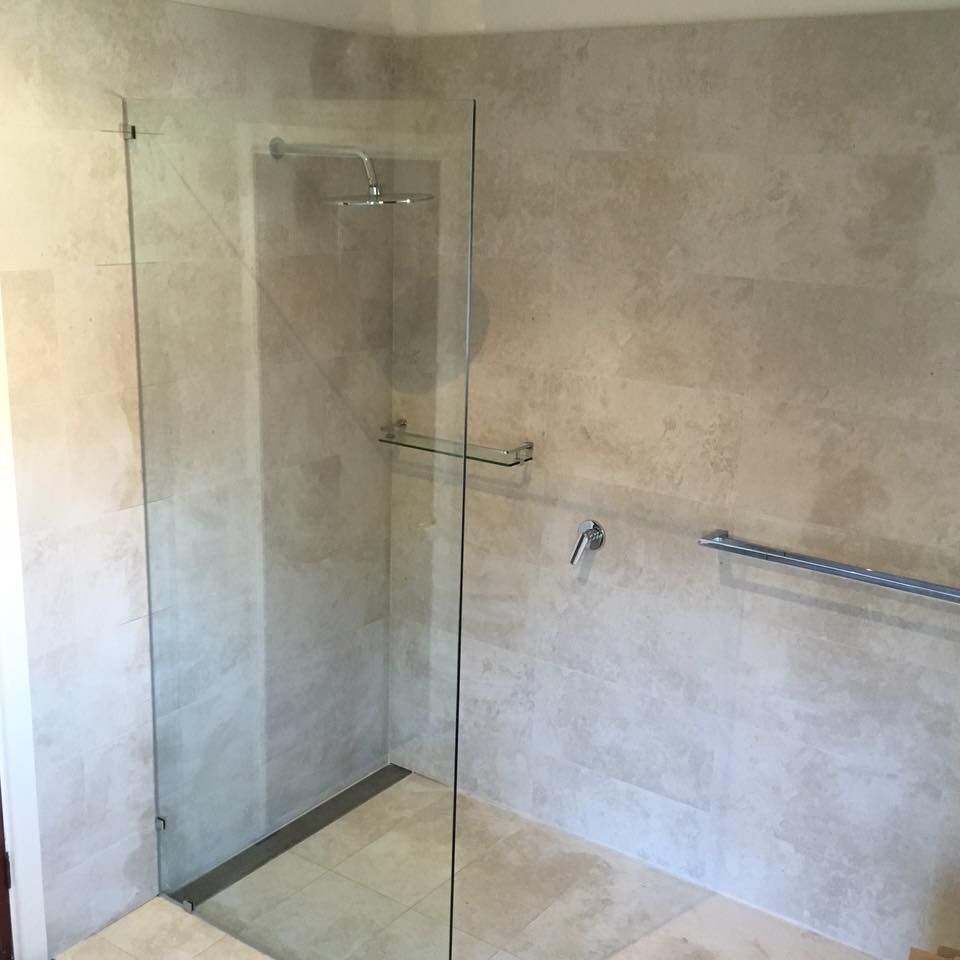 A Bathroom with A Walk in Shower with A Glass Door — Distinctive Glass & Aluminium in Dapto, NSW