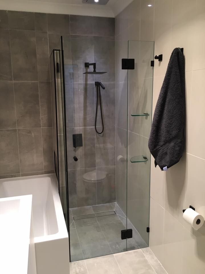A Bathroom with A Walk in Shower and A Bathtub — Distinctive Glass & Aluminium in Kiama, NSW