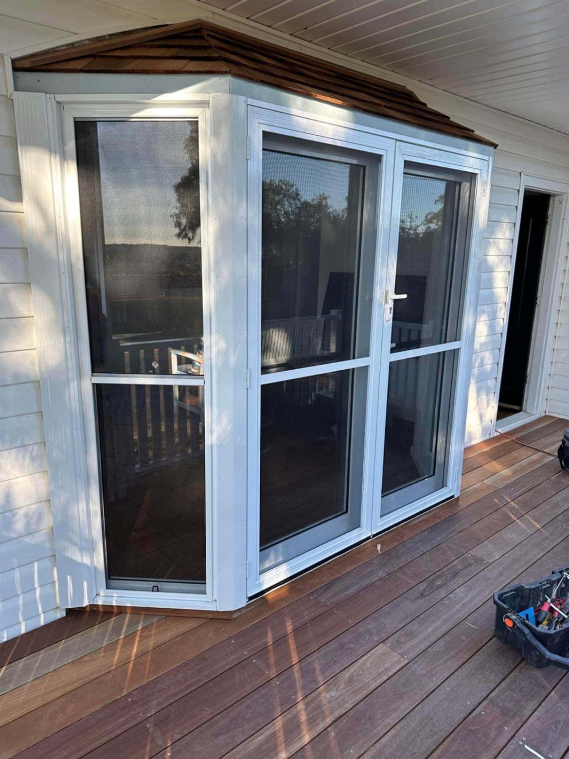 A White House with Sliding Glass Doors — Distinctive Glass & Aluminium in Port Kembla, NSW