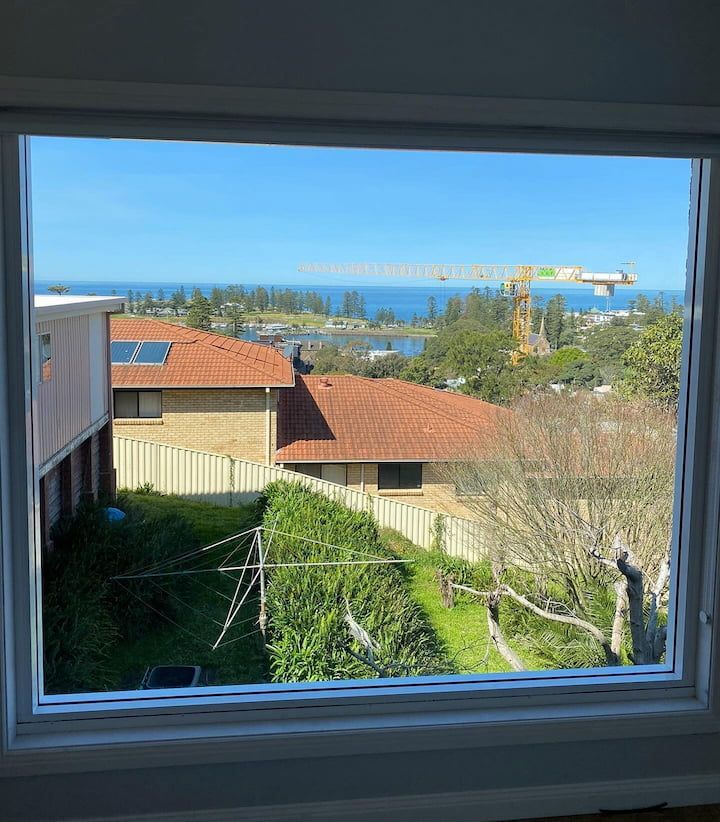 A Window with A View of A House and The Ocean — Distinctive Glass & Aluminium in Port Kembla, NSW