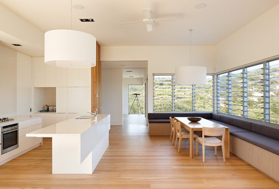A Kitchen and Dining Room with A Table and Chairs — Distinctive Glass & Aluminium in Port Kembla, NSW