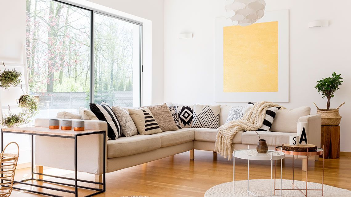 A Living Room with A Couch, Table, and Window — Distinctive Glass & Aluminium in Port Kembla, NSW