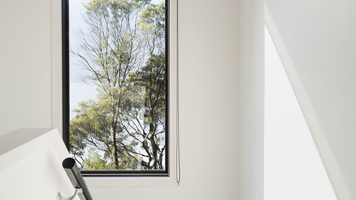 A Room with A Staircase and A Window with A View of Trees — Distinctive Glass & Aluminium in Albion Park, NSW